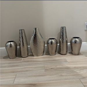 Six metal vases never used